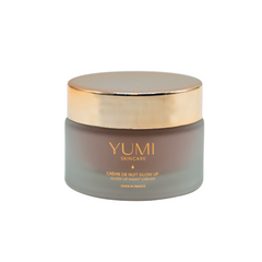 YUMI skincare cream jar with gold lid on a white background