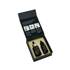 Two black bottles in an open black box with instructions on a white background